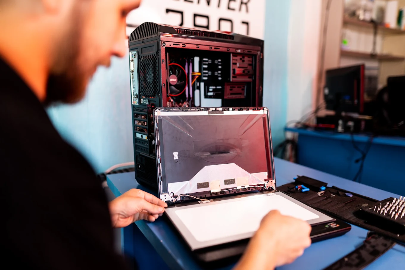Person repairing computer hardware components.